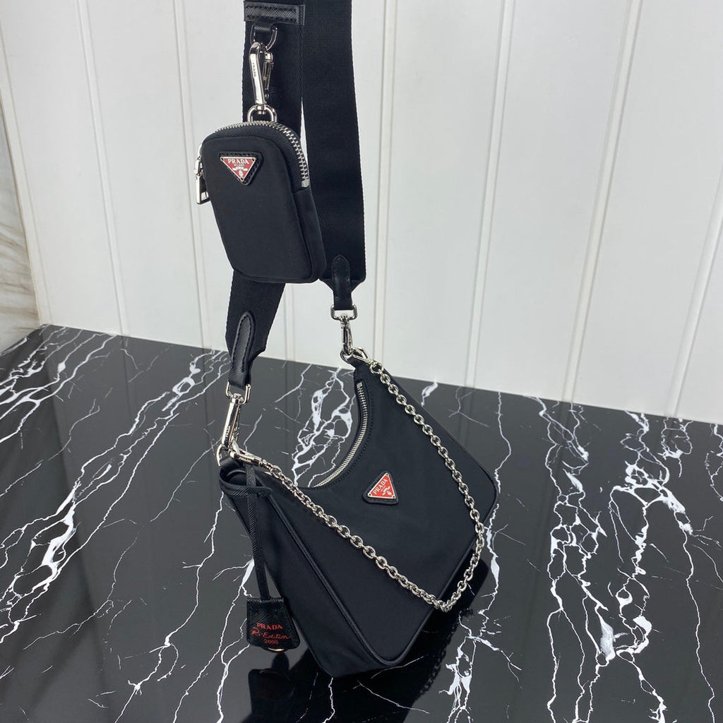 PRADA HOBO 22 BAG IN BLACK RE-NYLON WITH RED LOGO