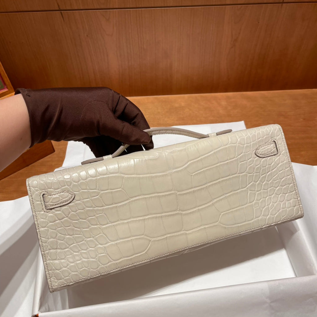 HERMES KELLY CUT 31 IN WHITE CREAM ALLIGATOR LEATHER WITH GOLD HARDWARE