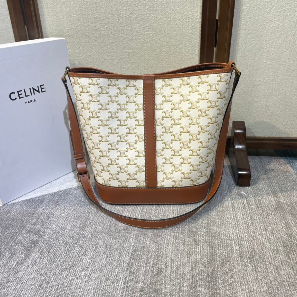 CELINE BUCKET 33 IN WHITE TRIOMPHE CANVAS AND BRONZE BROWN CALFSKIN TRIM