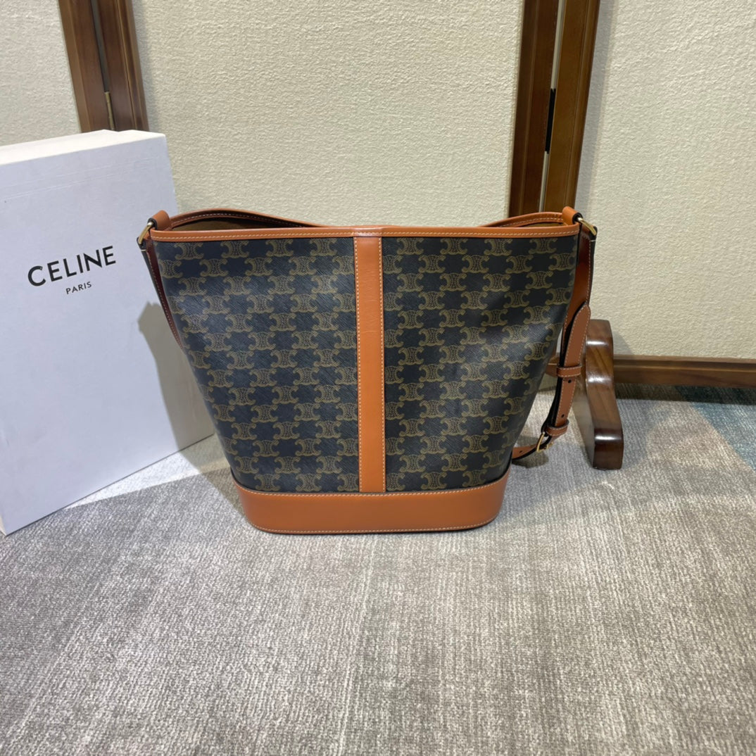 CELINE BUCKET 33 IN BLACK TRIOMPHE CANVAS AND BRONZE BROWN CALFSKIN TRIM