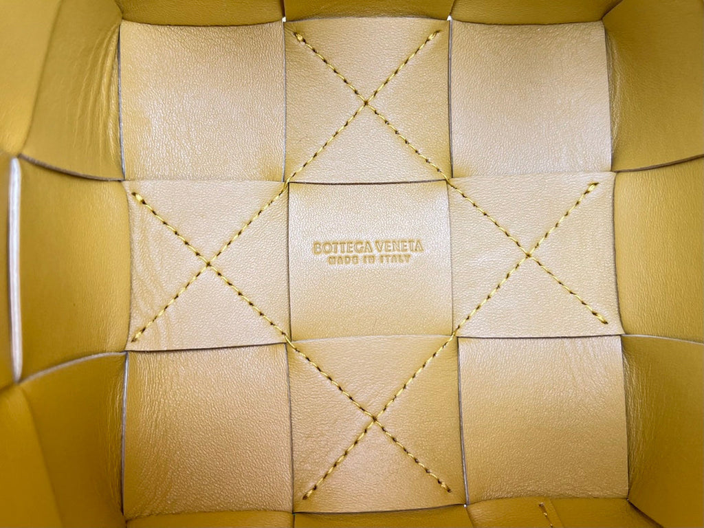 BOTTEGA VENETA SMALL CASSETTE BUCKET 18 IN MERIGOLD CALFSKIN