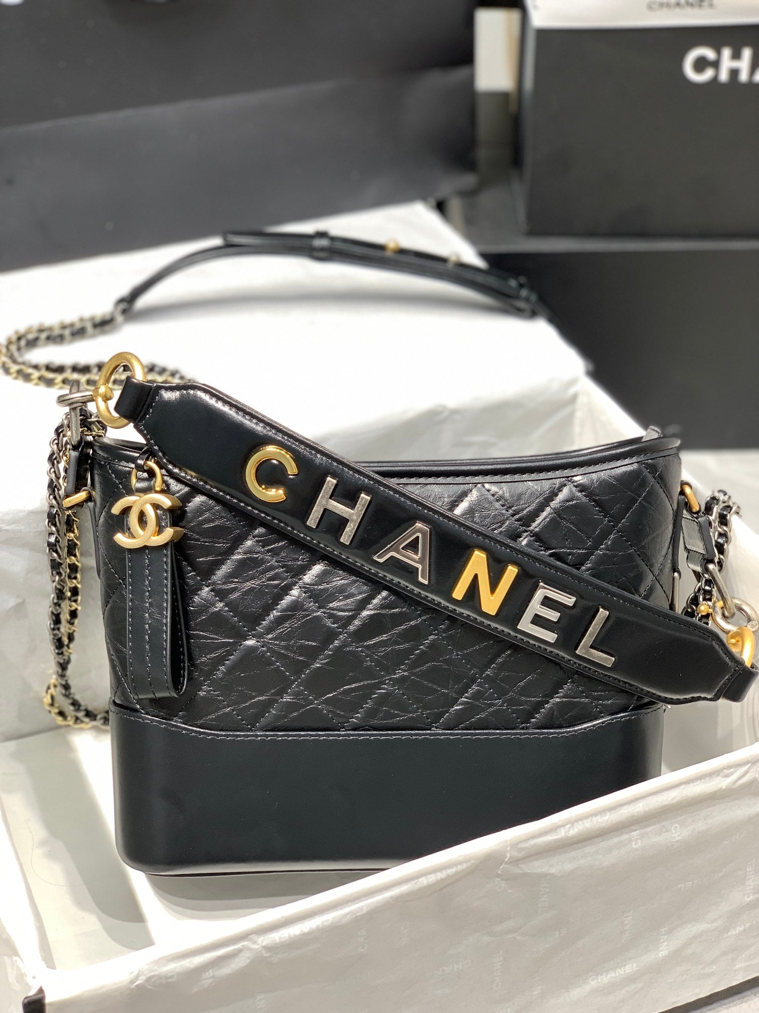 CHANEL HOBO BAG 25 WITH STRAP IN BLACK CALFSKIN GOLD AND SILVER HARDWARE