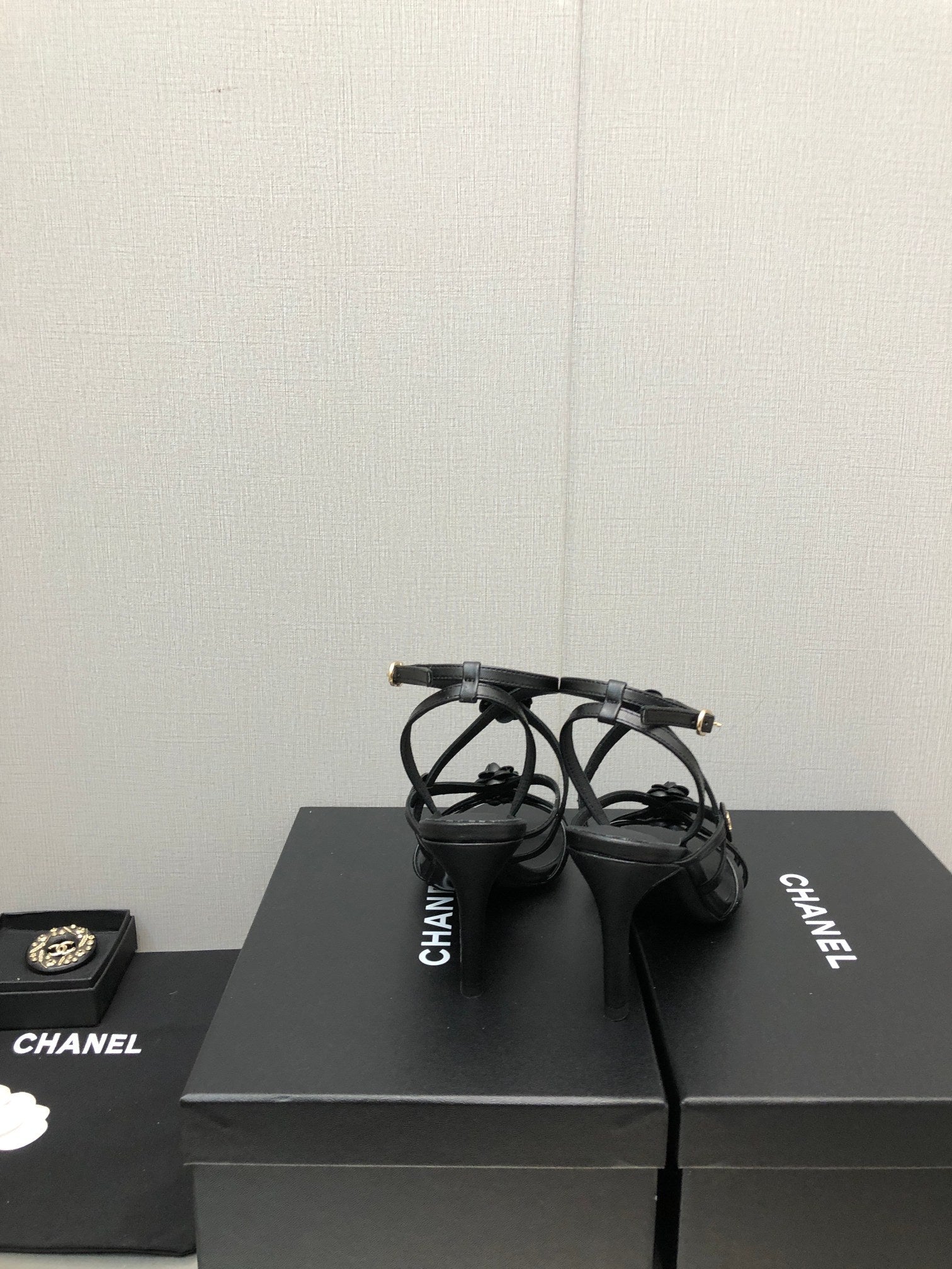 CHANEL FLORAL HIGH HEEL SANDAL IN BLACK LAMBSKIN