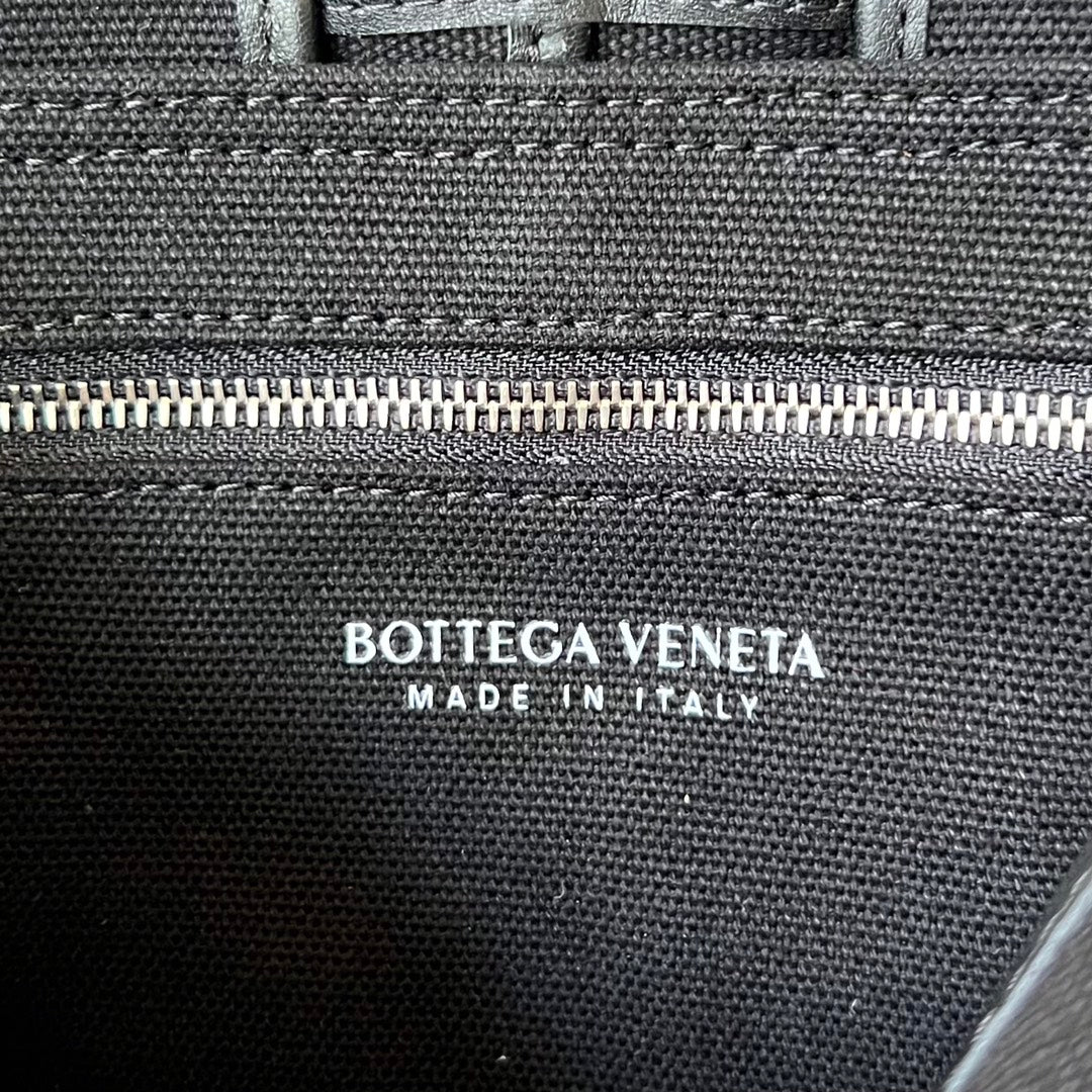 BOTTEGA VENETA SMALL CASSETTE 23 IN BLACK CANVAS AND CALFSKIN TRIM
