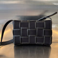 BOTTEGA VENETA SMALL CASSETTE 23 IN BLACK CANVAS AND CALFSKIN TRIM