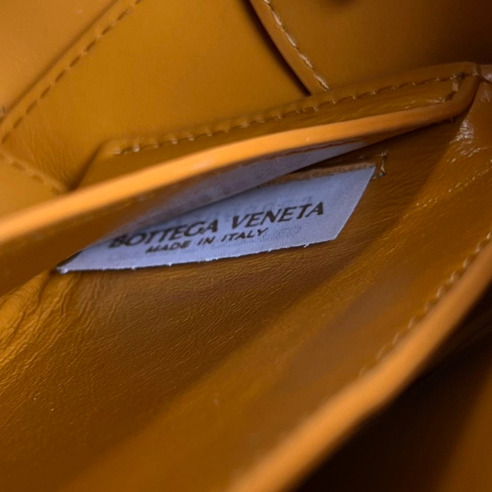 BOTTEGA VENETA SMALL BRICK CASSETTE 23 IN SANDSTONE ORANGE SOFT LAMBSKIN