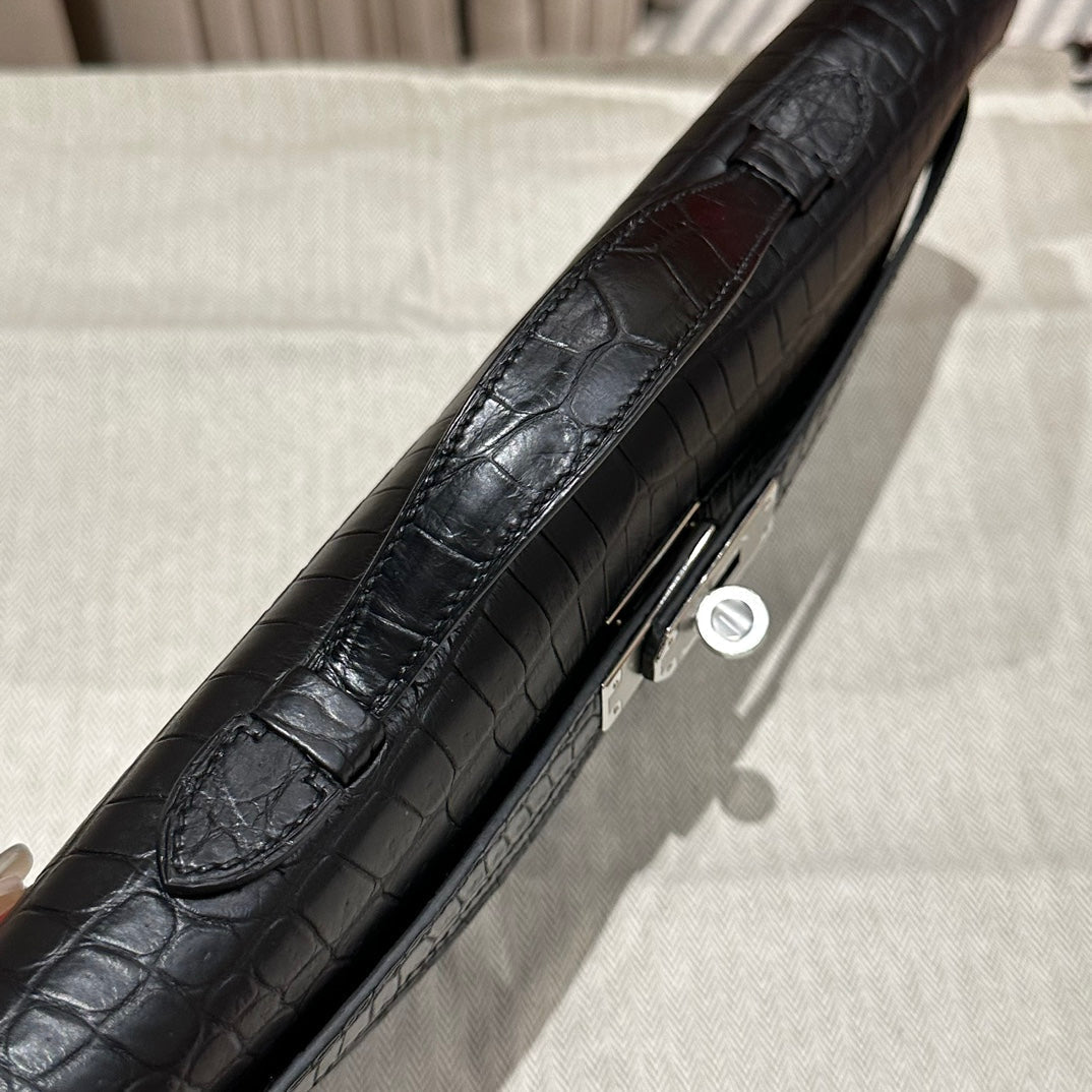 HERMES KELLY CUT 31 IN BLACK SHINY ALLIGATOR LEATHER WITH SILVER HARDWARE