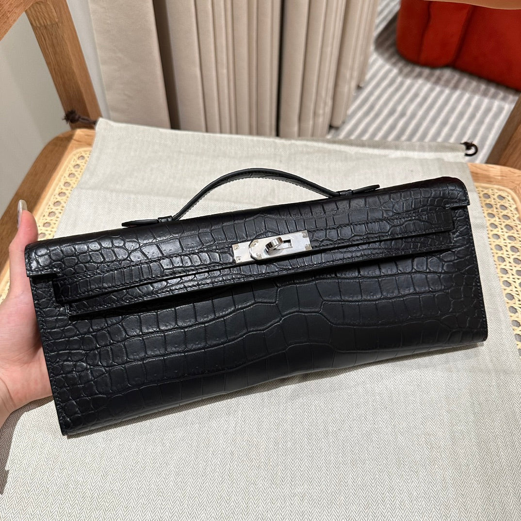 HERMES KELLY CUT 31 IN BLACK SHINY ALLIGATOR LEATHER WITH SILVER HARDWARE