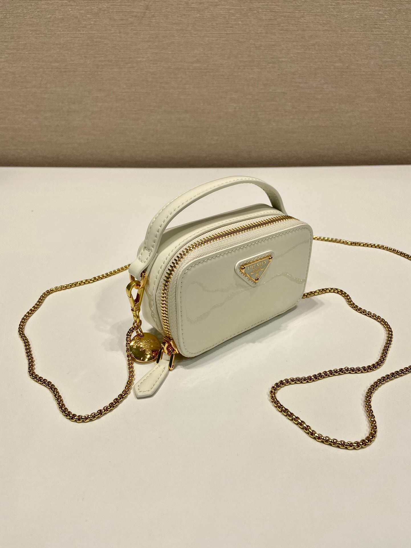 PRADA MINI HAND BAG 11 WITH GOLD STRAP IN WHITE PATENT CALFSKIN