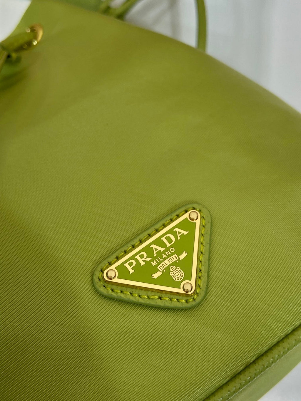 PRADA BUCKET BAG 19 IN APPLE GREEN RE-NYLON AND SAFFIANO LEATHER HANDLE