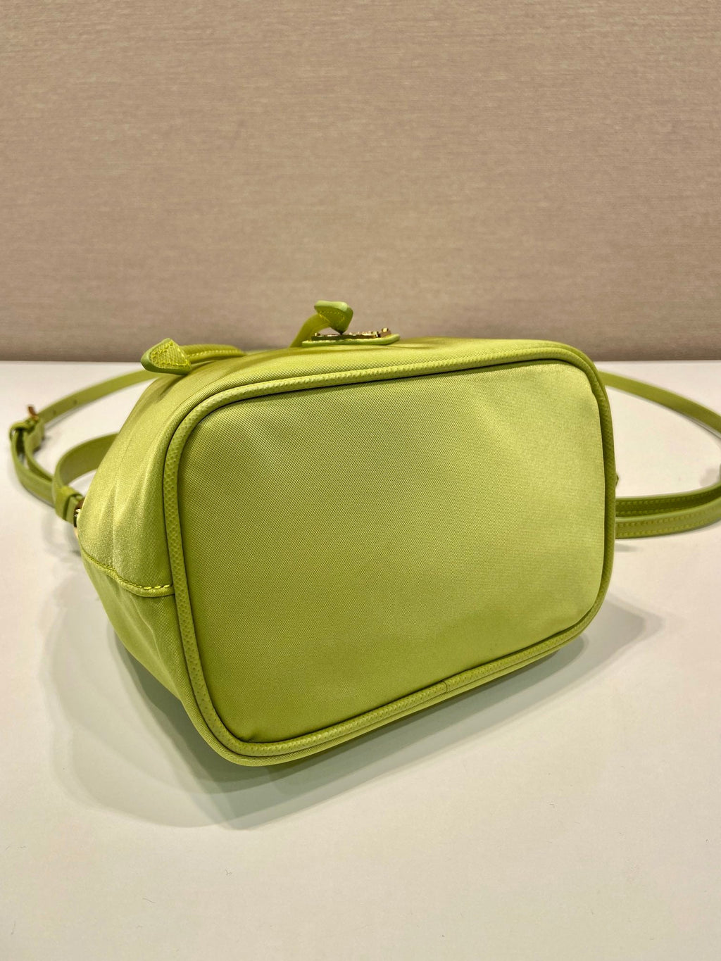 PRADA BUCKET BAG 19 IN APPLE GREEN RE-NYLON AND SAFFIANO LEATHER HANDLE