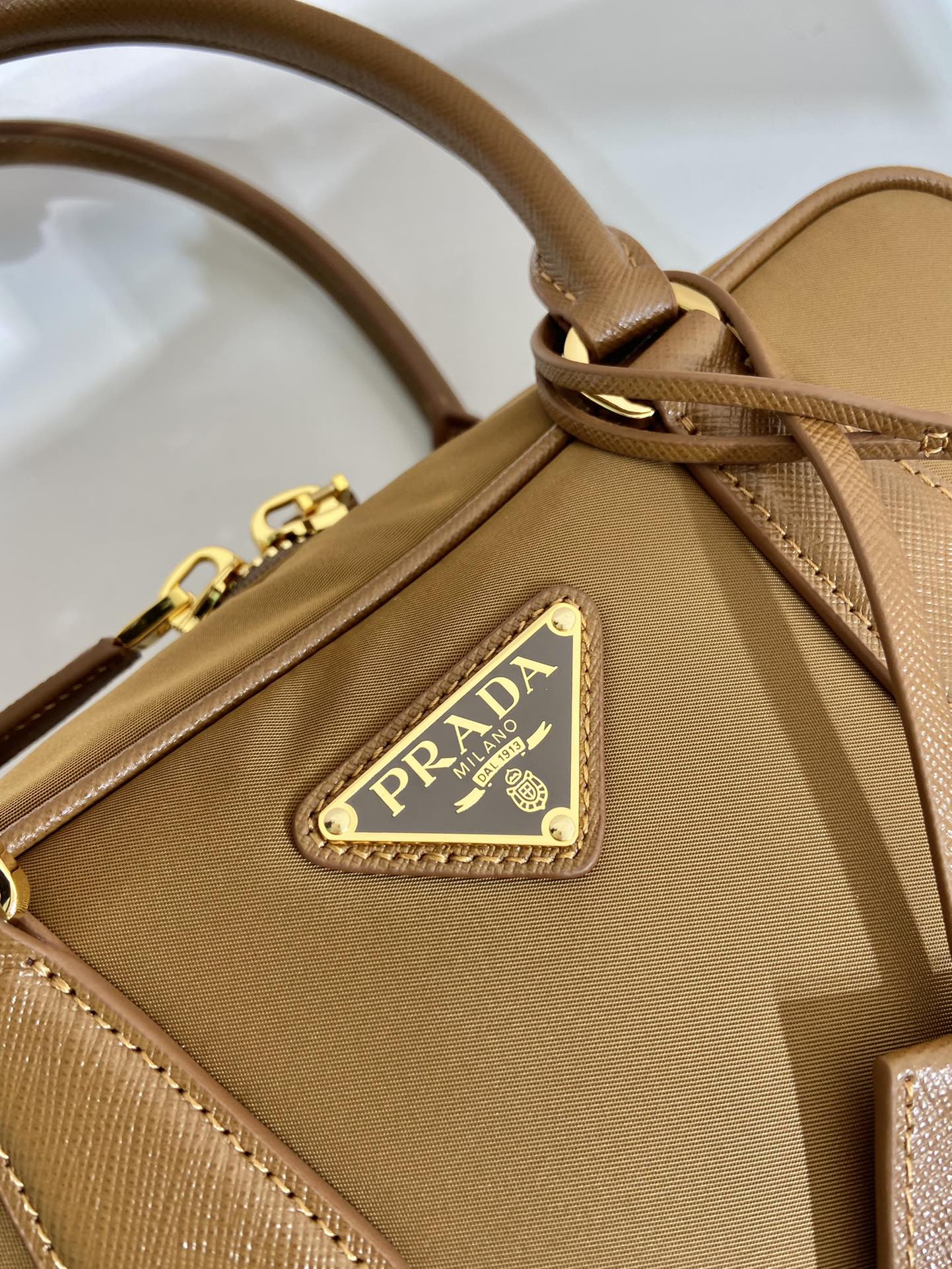 PRADA SMALL TOP HANDLE BAG 25 IN GOLDEN BROWN NYLON AND CALFSKIN TRIM