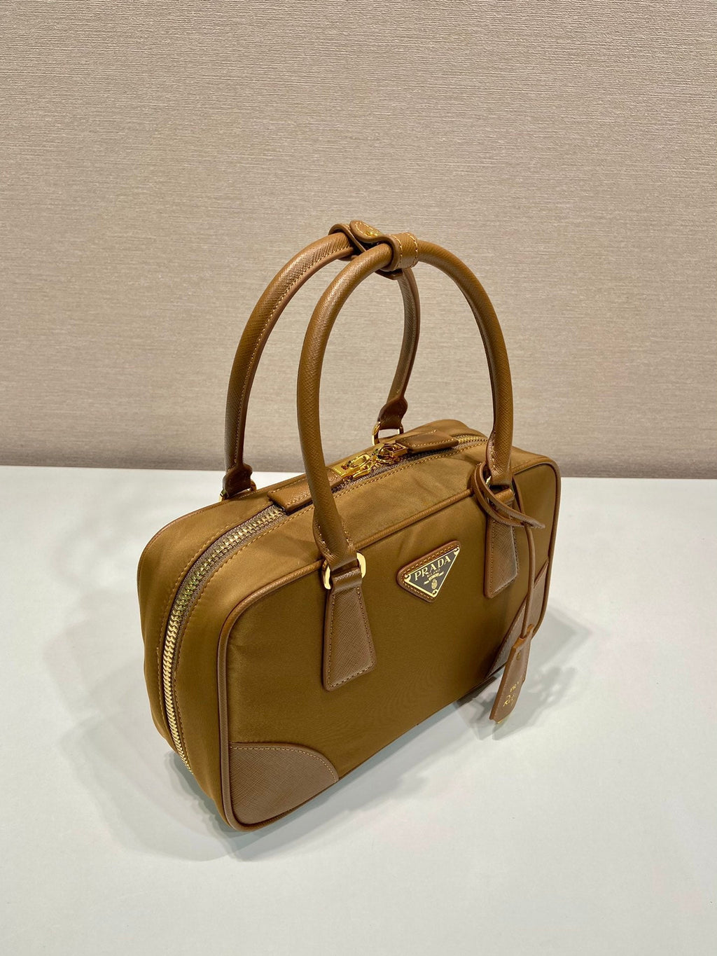 PRADA SMALL TOP HANDLE BAG 25 IN GOLDEN BROWN NYLON AND CALFSKIN TRIM