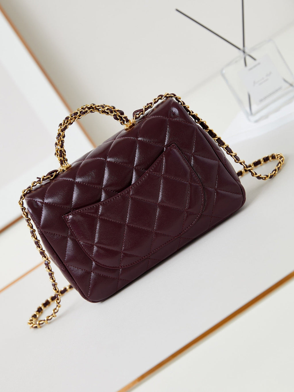 CHANEL FLAP BAG WITH TOP HANDLE 25 IN WINE RED OIL-WAX LAMBSKIN GOLD HARDWARE