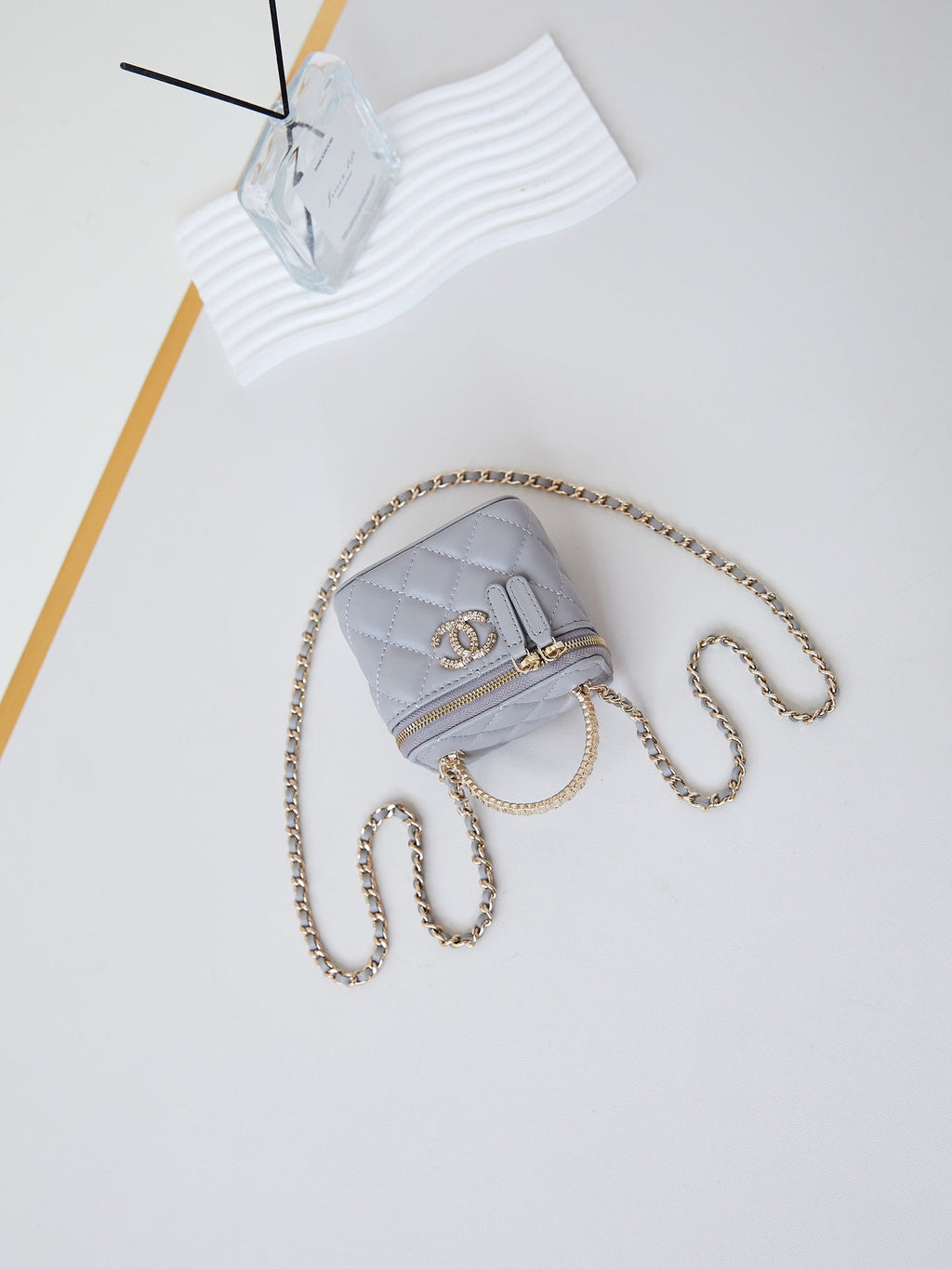 CHANEL 25S MINI VANITY BAG 11 CM IN GREY LAMBSKIN WITH CRYSTAL-EMBELLISHED  LOGO