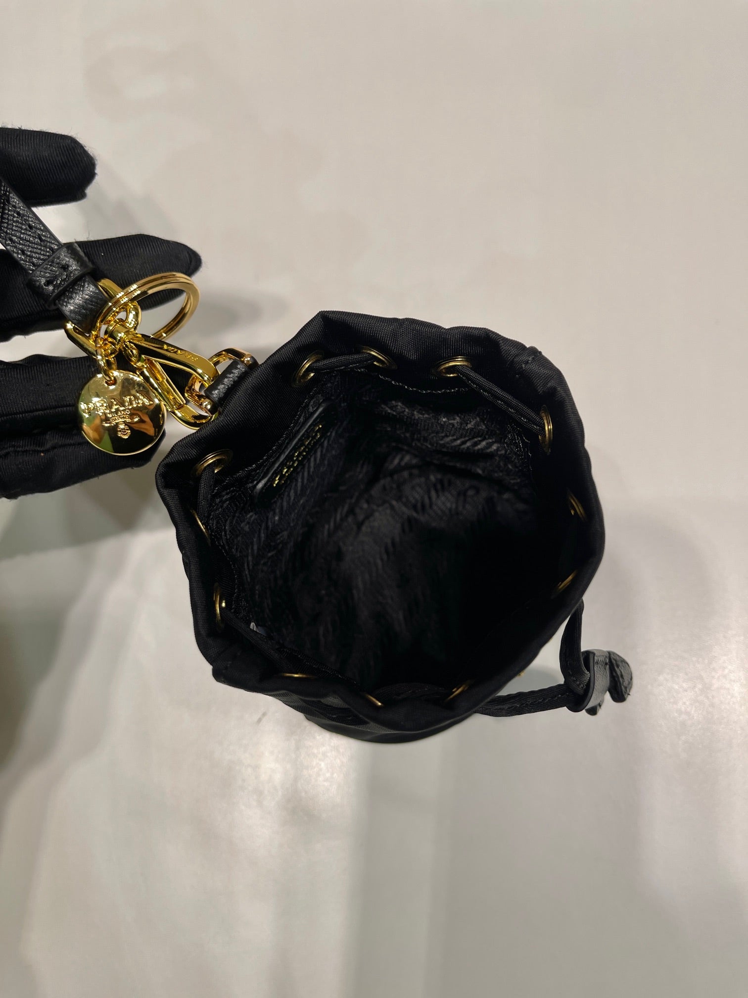 PRADA MINI BUCKET BAG 10 IN BLACK RE-NYLON AND SAFFIANO LEATHER STRAP