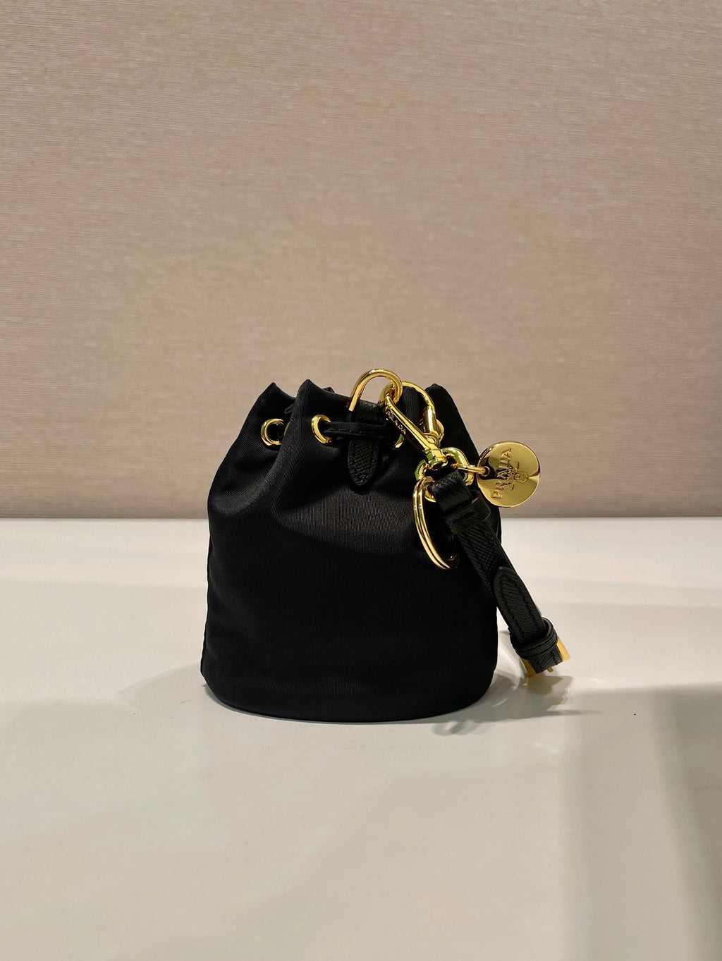 PRADA MINI BUCKET BAG 10 IN BLACK RE-NYLON AND SAFFIANO LEATHER STRAP