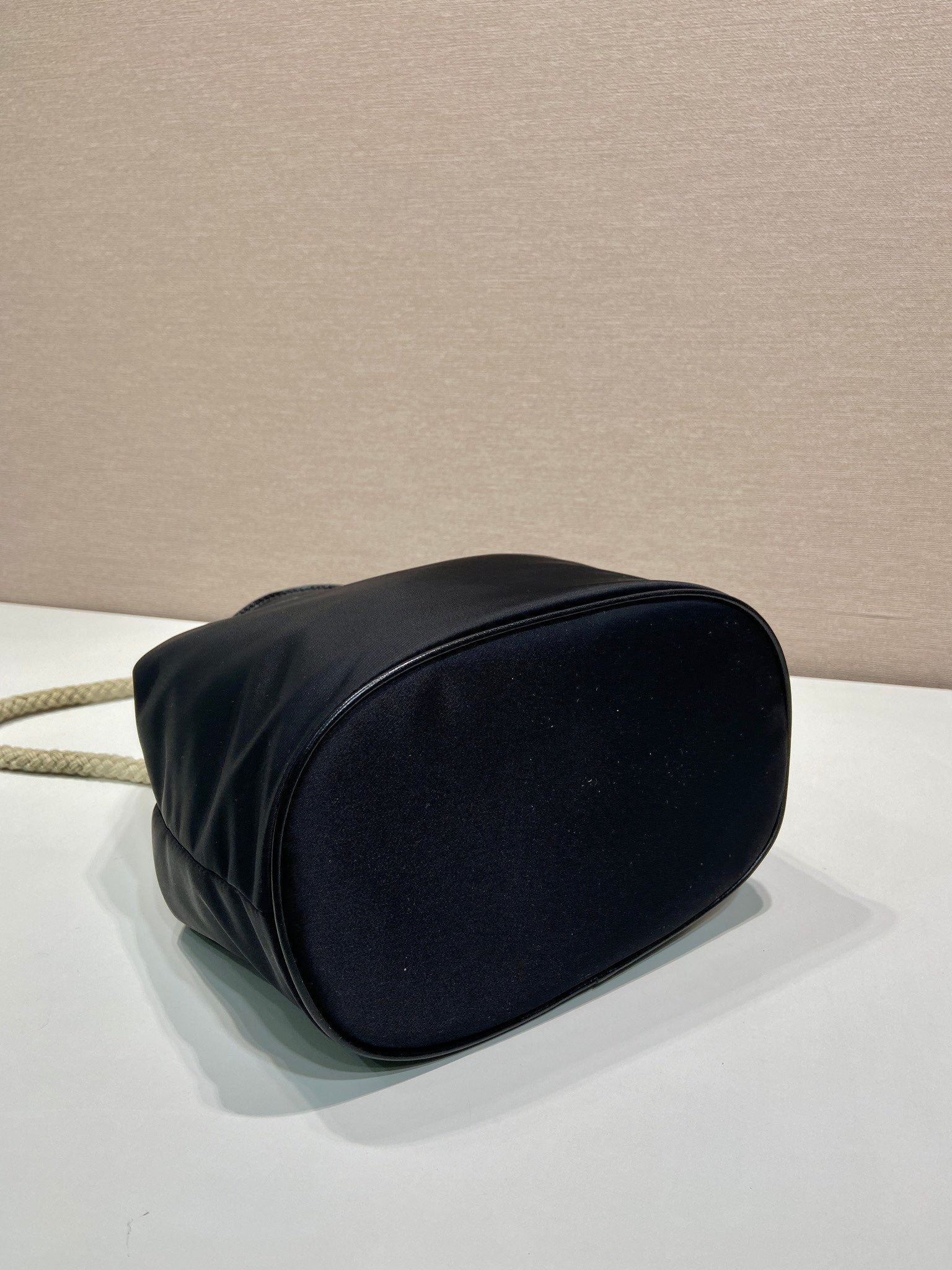 PRADA BUCKET BAG 28 IN BLACK RE-NYLON GOLD LOGO