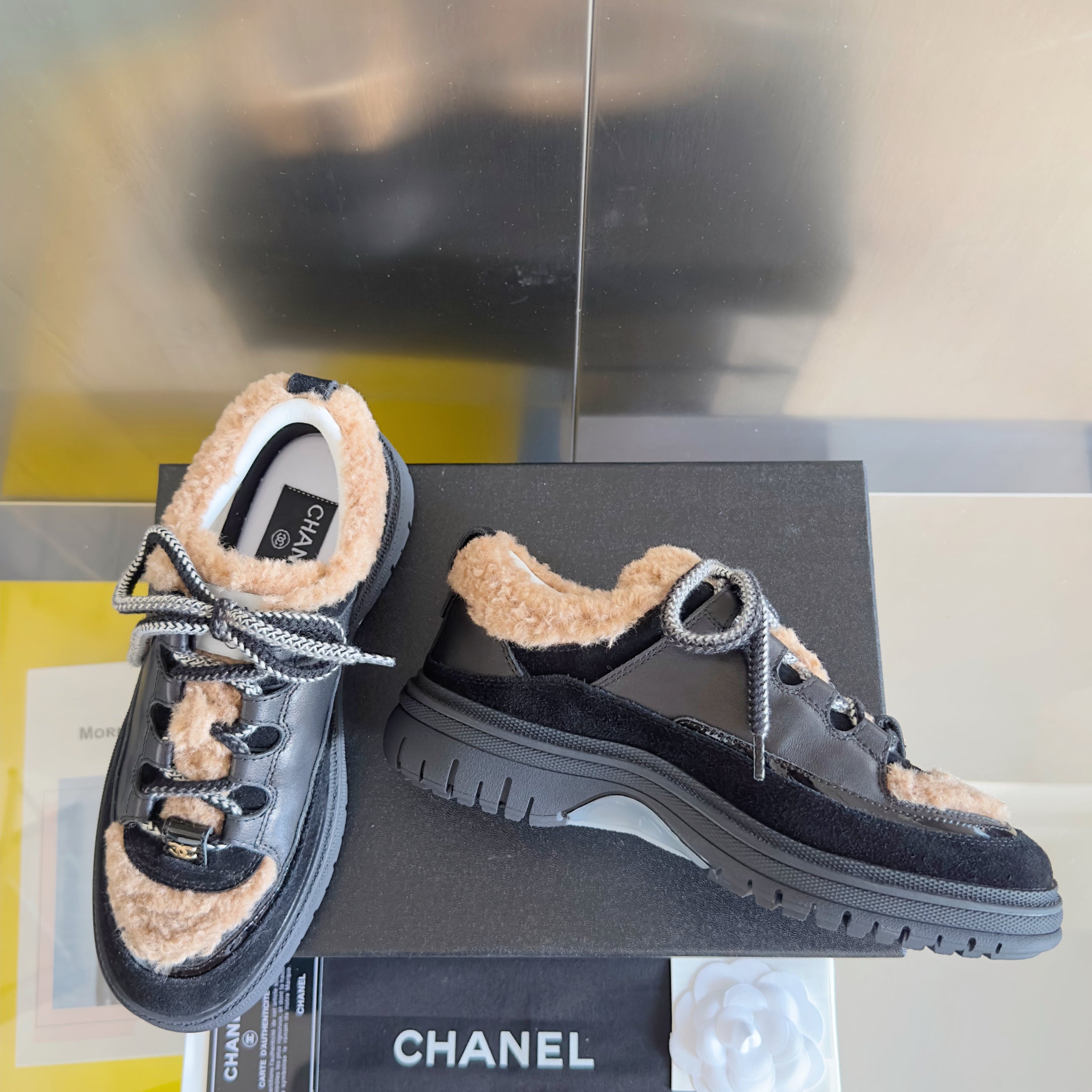 CHANEL 25S SNEAKERS WITH FUR AENTS 40MM IN BLACK AND BROWN CALFSKIN