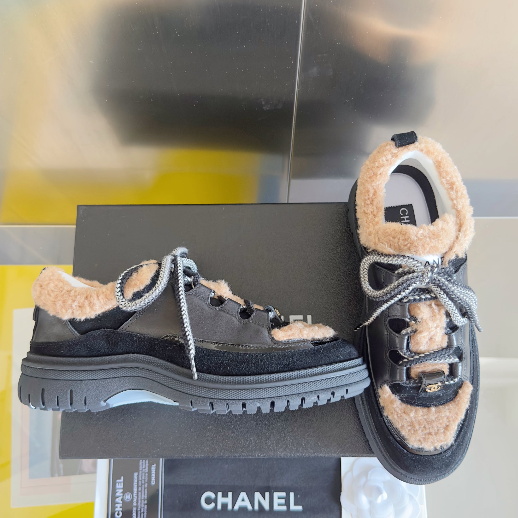 CHANEL 25S SNEAKERS WITH FUR AENTS 40MM IN BLACK AND BROWN CALFSKIN