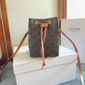 CELINE MICRO SAILOR 17 IN BLACK TRIOMPHE CANVAS AND BROWN CALFSKIN TRIM