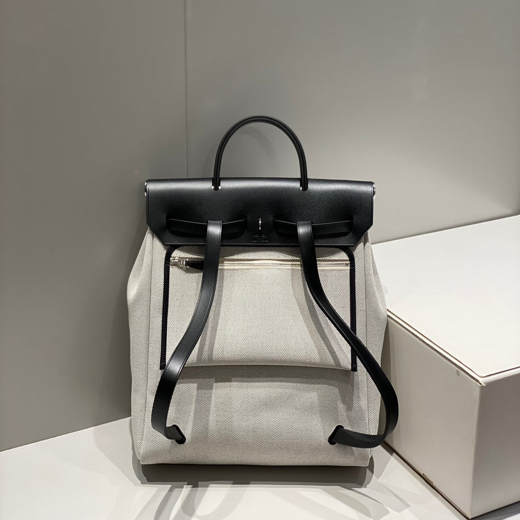 HERMES HERBAG A DOS ZIP RETOURNE BACKPACK 29 IN OFF-WHITE CANVAS AND BLACK CALFSKIN