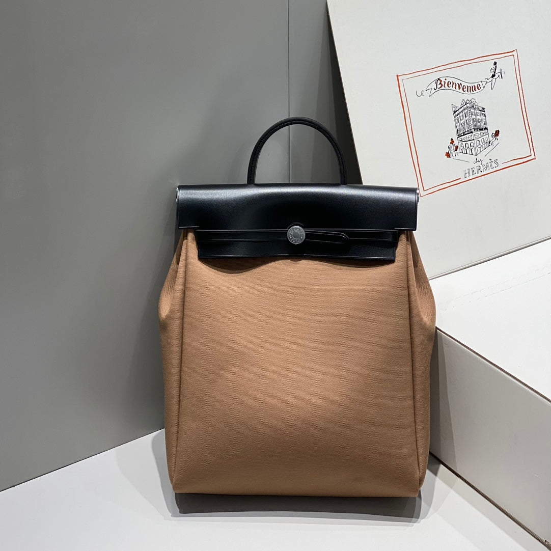 HERMES HERBAG A DOS ZIP RETOURNE BACKPACK 29 IN BROWN CANVAS AND BLACK CALFSKIN
