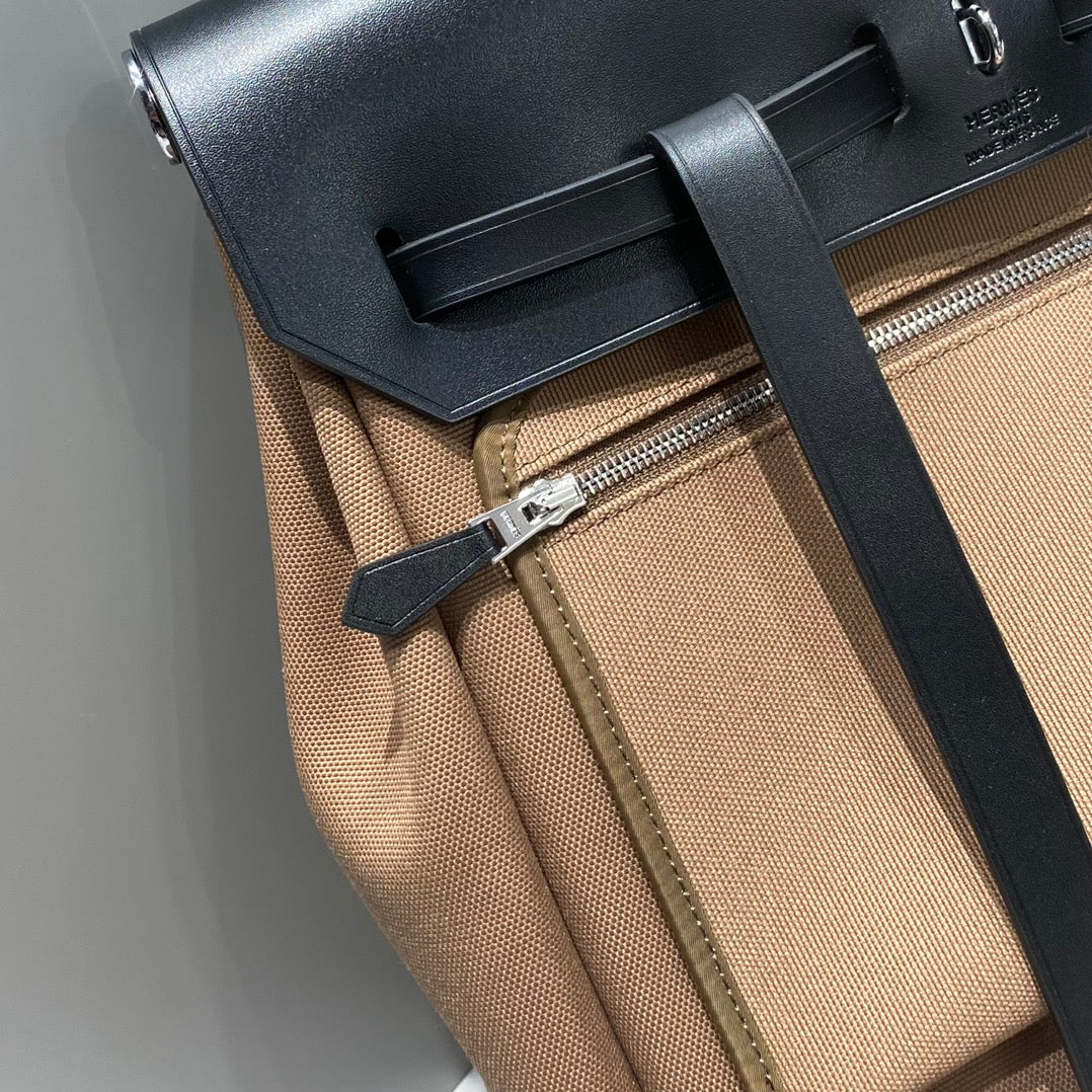 HERMES HERBAG A DOS ZIP RETOURNE BACKPACK 29 IN BROWN CANVAS AND BLACK CALFSKIN