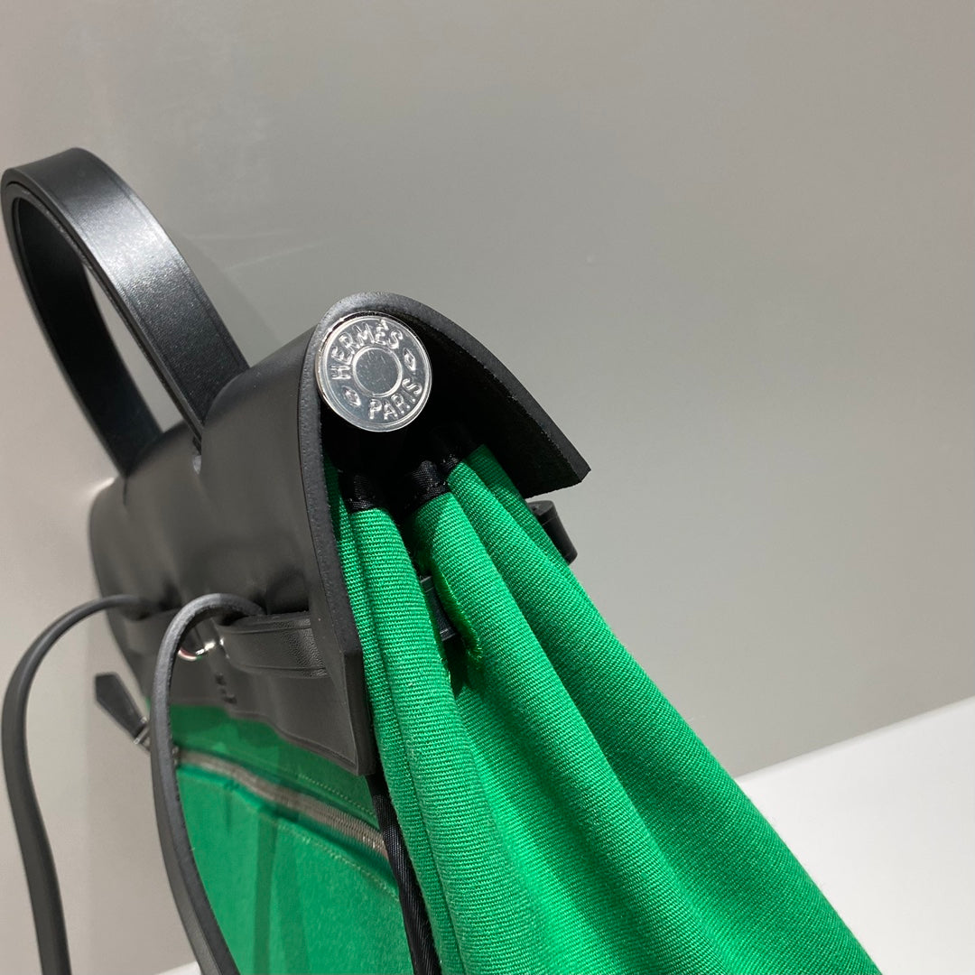 HERMES HERBAG A DOS ZIP RETOURNE BACKPACK 29 IN GREEN CANVAS AND BLACK CALFSKIN