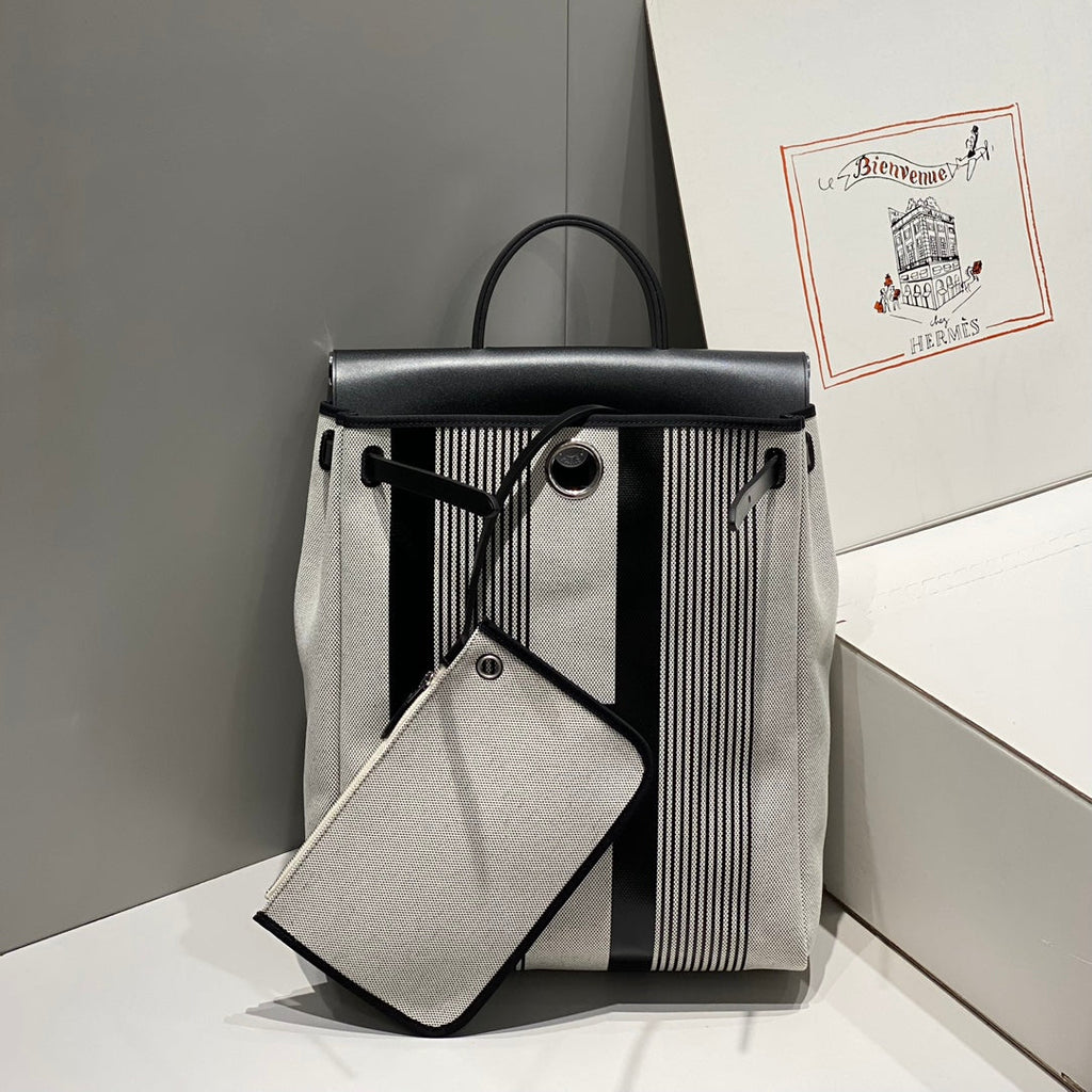 HERMES HERBAG A DOS ZIP RETOURNE BACKPACK 29 IN OFF-WHITE MIX BLACK CANVAS AND CALFSKIN