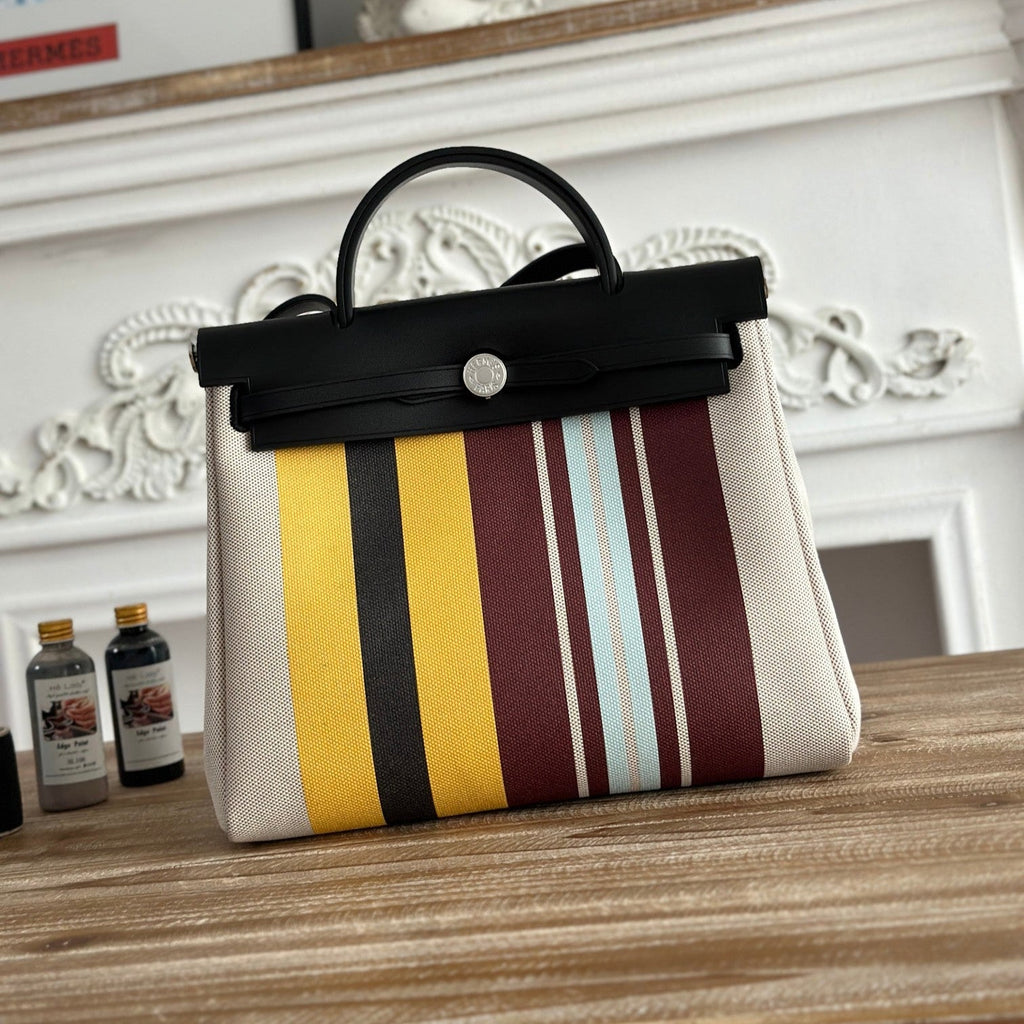 HERMES HERBAG ZIP 31 LAQUERED BAG IN BROWN MIX YELLOW H PLUME CANVAS