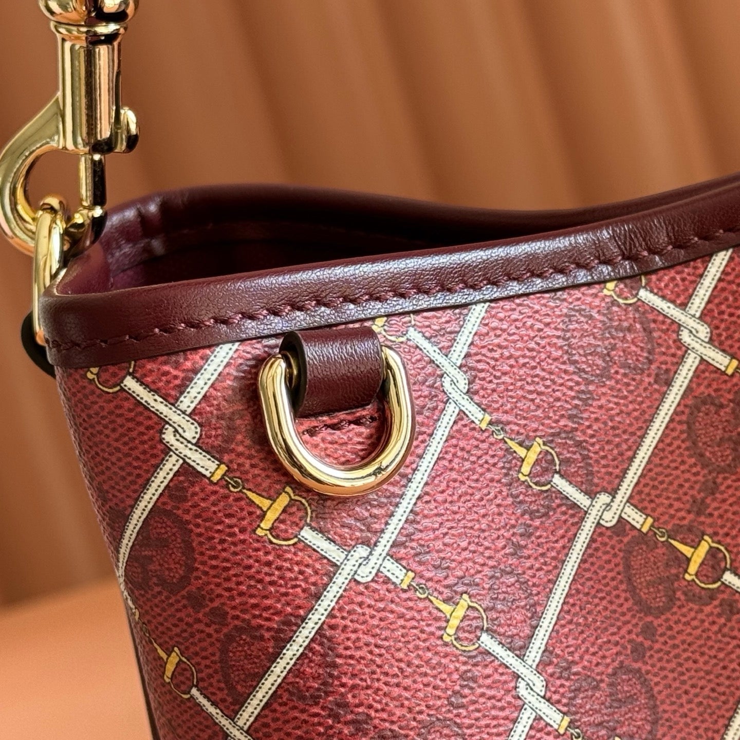 GUCCI 26S  EMBLEM BUCKET BAG 19 IN DARK RED COATED FABRIC