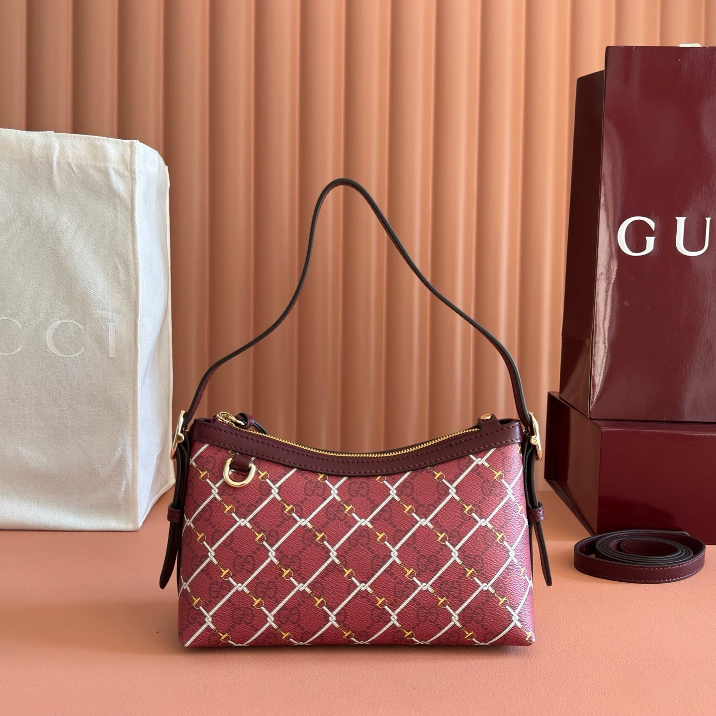 GUCCI 26S  EMBLEM BUCKET BAG 22 IN DARK RED COATED FABRIC