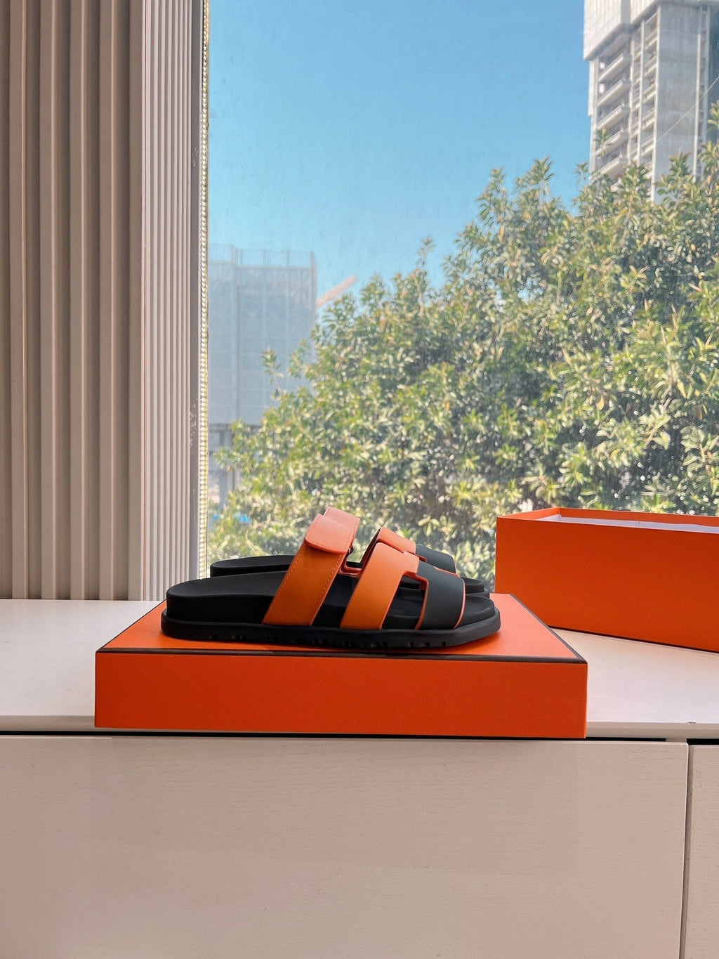 HERMES CHYPRE SANDAL IN VIVID ORANGE MIX BLACK CALFSKIN