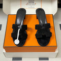 HERMES 25S ORAN HIGH‑HEEL SANDAL IN BLACK SUEDE AND LAMBSKIN
