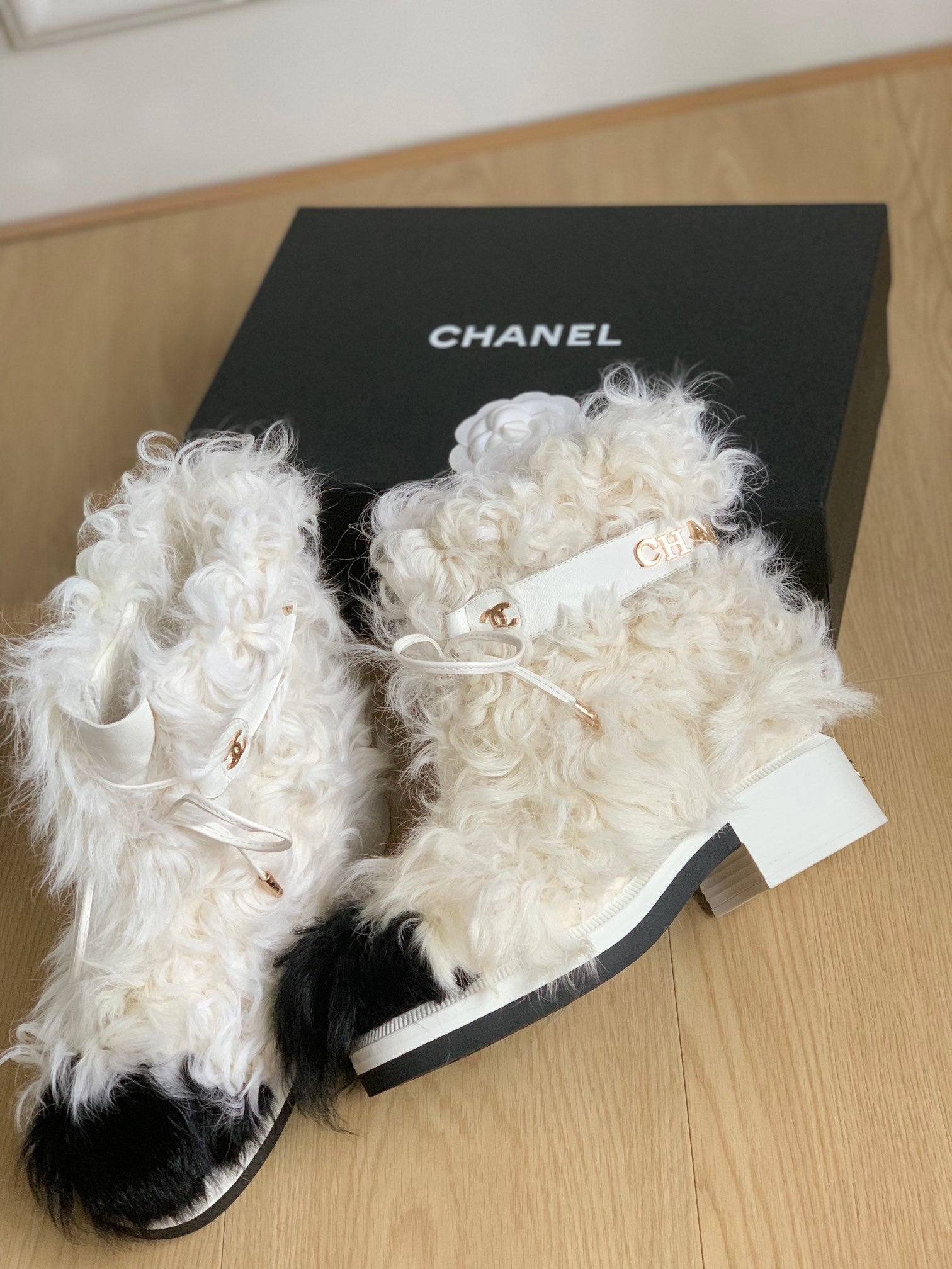CHANEL ANKLE BOOTS IN WHITE MIX BLACK WOOL FUR