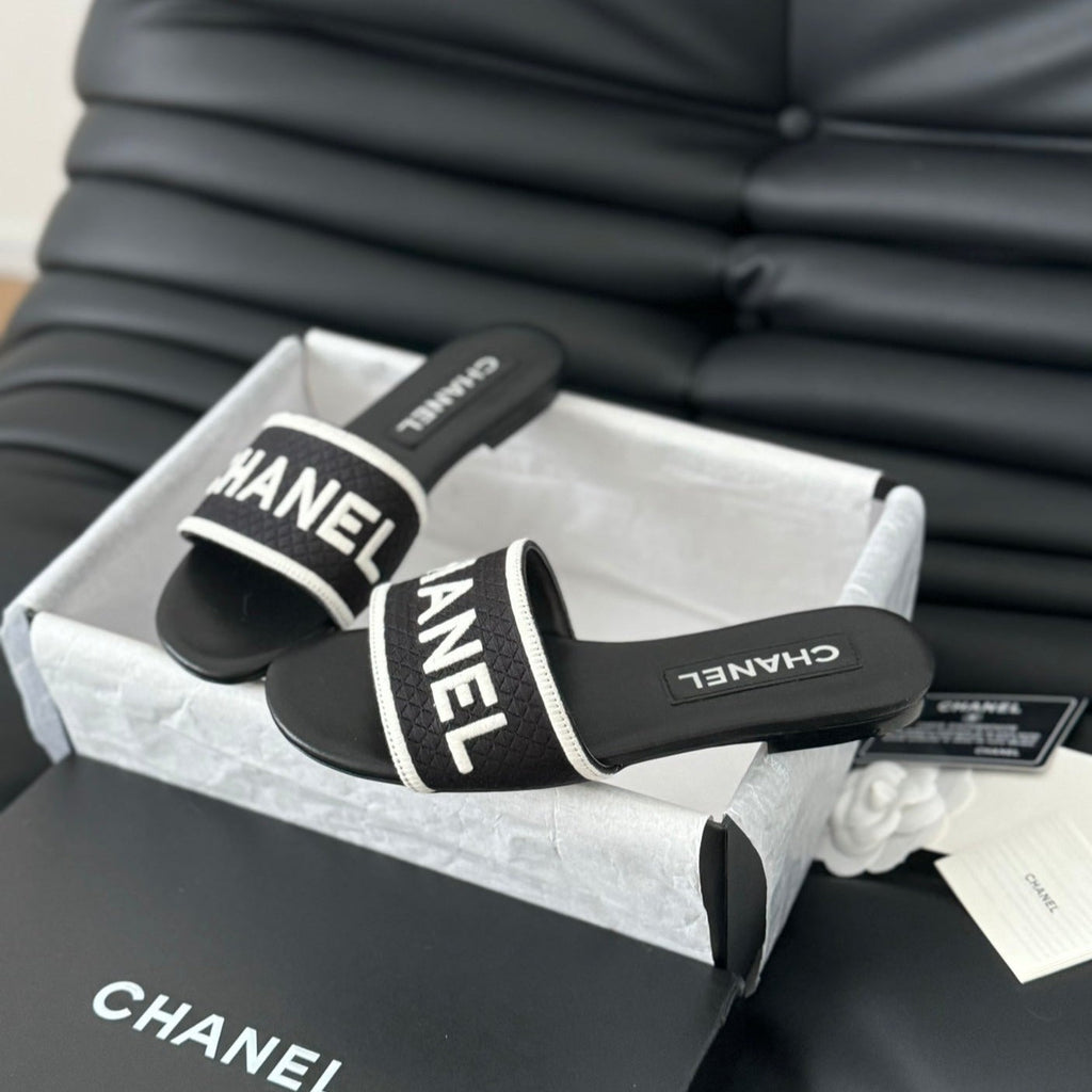 CHANEL Woven Embroidered Letter Slippers Black White