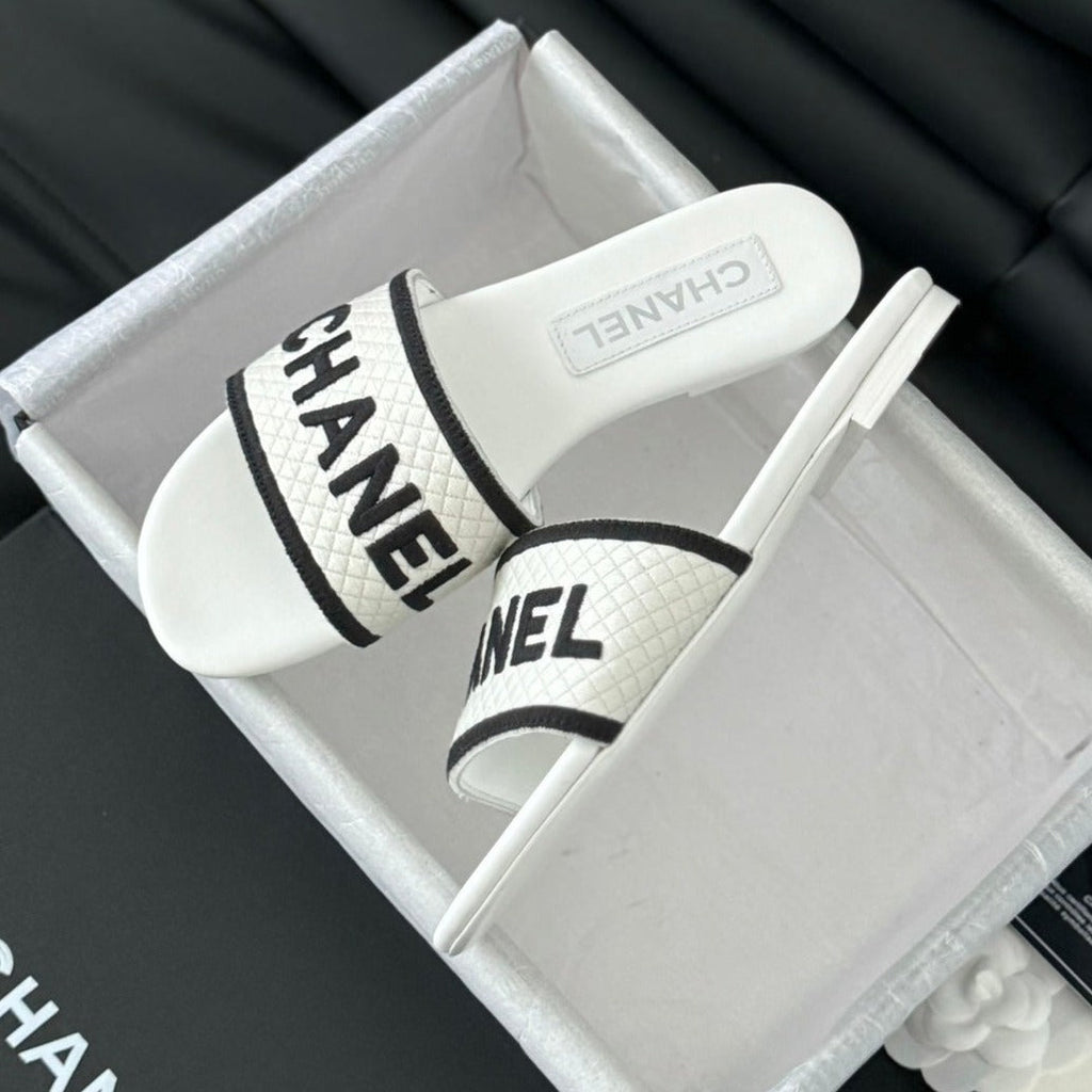 CHANEL Woven Embroidered Letter Slippers White Black
