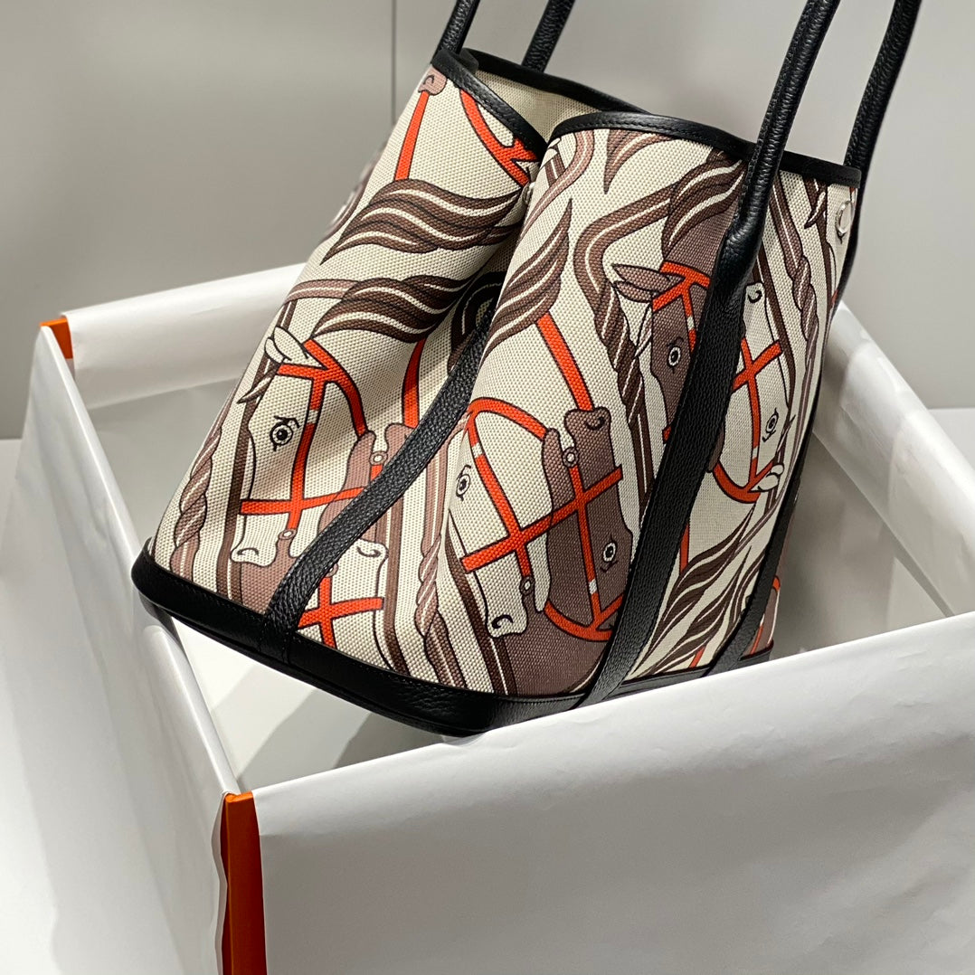 HERMES GARDEN PARTY 36 IN BEIGE ORANGE AND BROWN TOILE H CANVAS BLACK CALFSKIN HORSE TOTEM PRINT