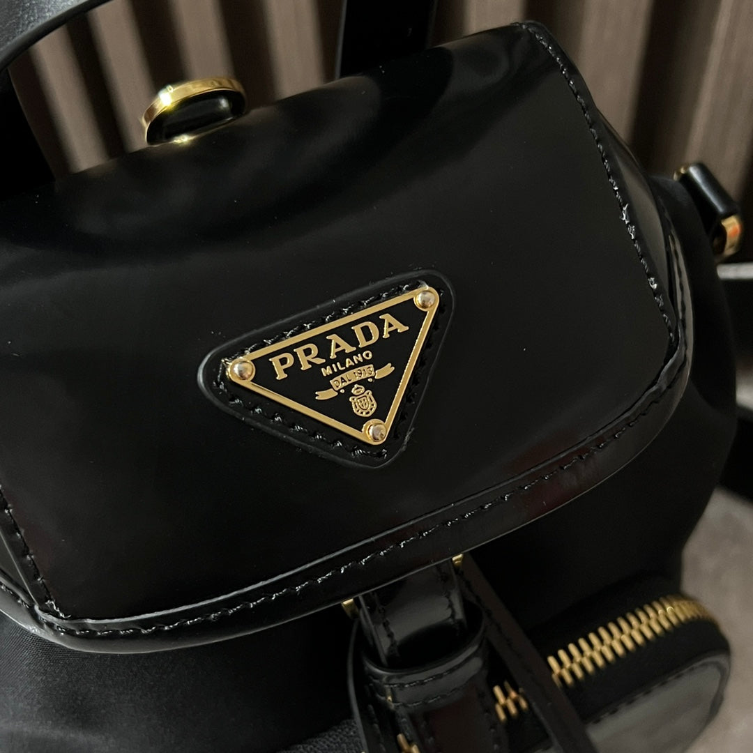 PRADA MINI BACKPACK 18 IN BLACK RE-NYLON AND GLOSSY CALFSKIN GOLD HARDWARE
