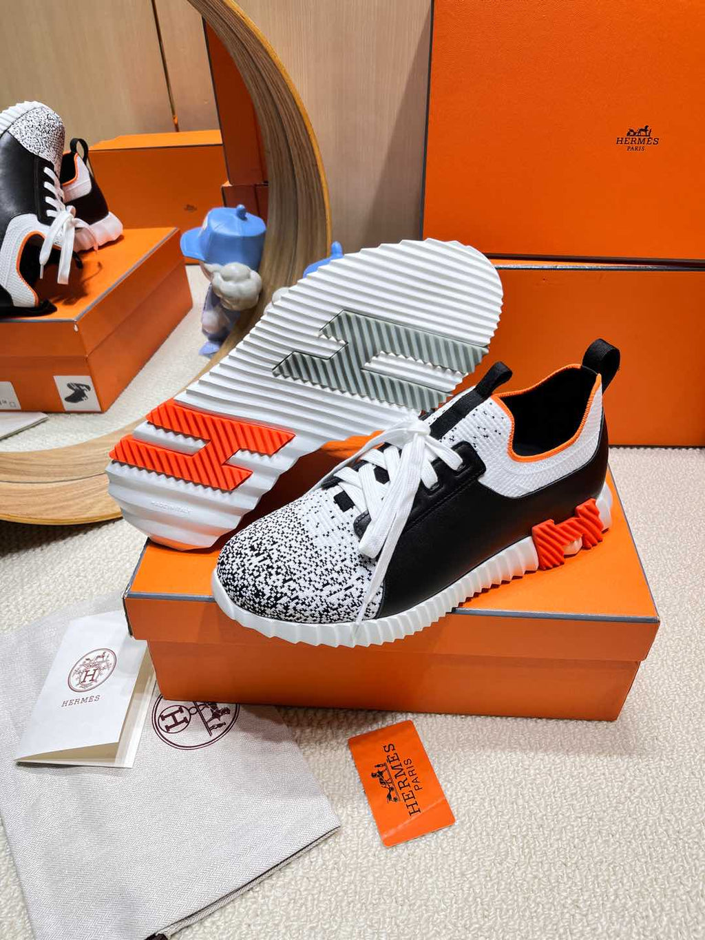 HERMES DEPART SLIP-ON SNEAKER IN WHITE MIX BLACK KNIT AND BLACK CALFSKIN