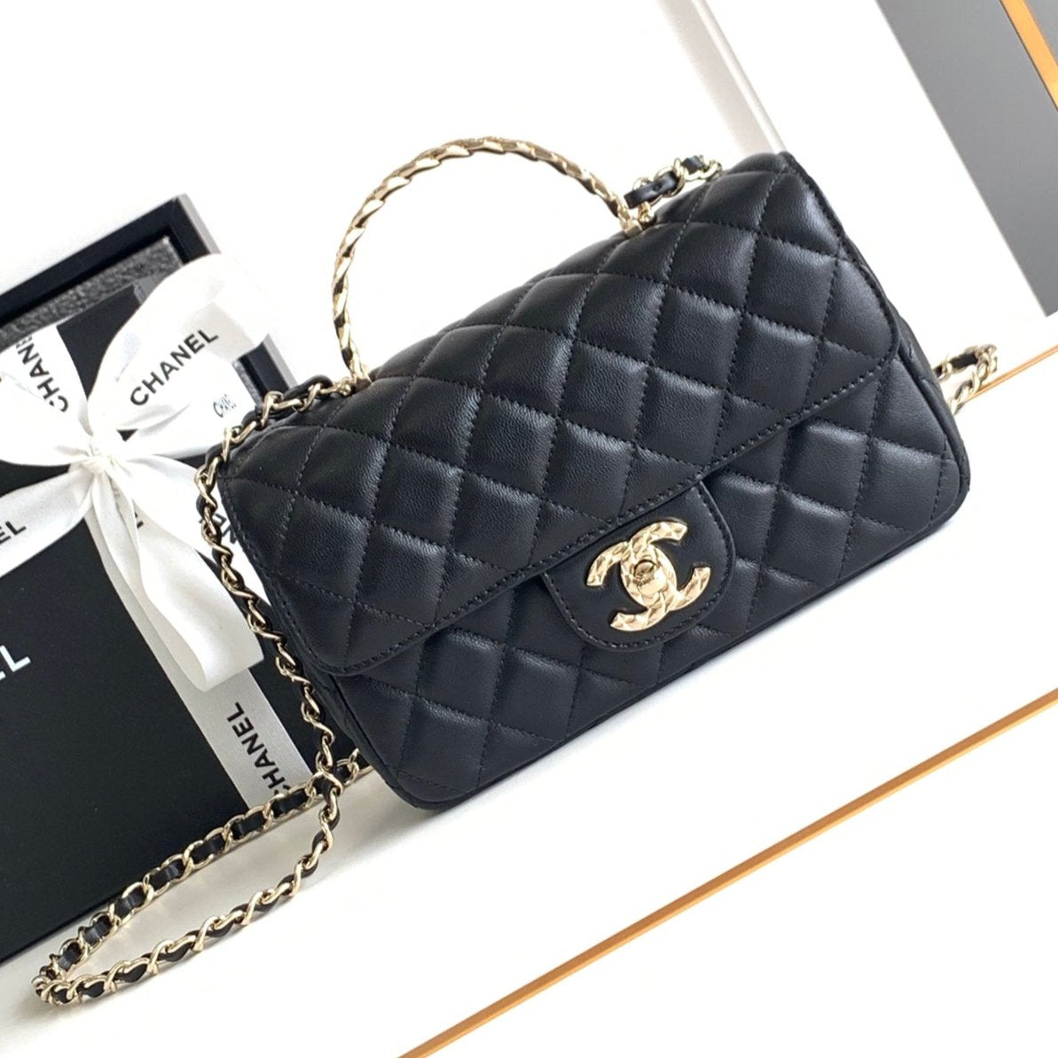 CHANEL MINI 20 FLAP BAG IN BLACK CALFSKIN