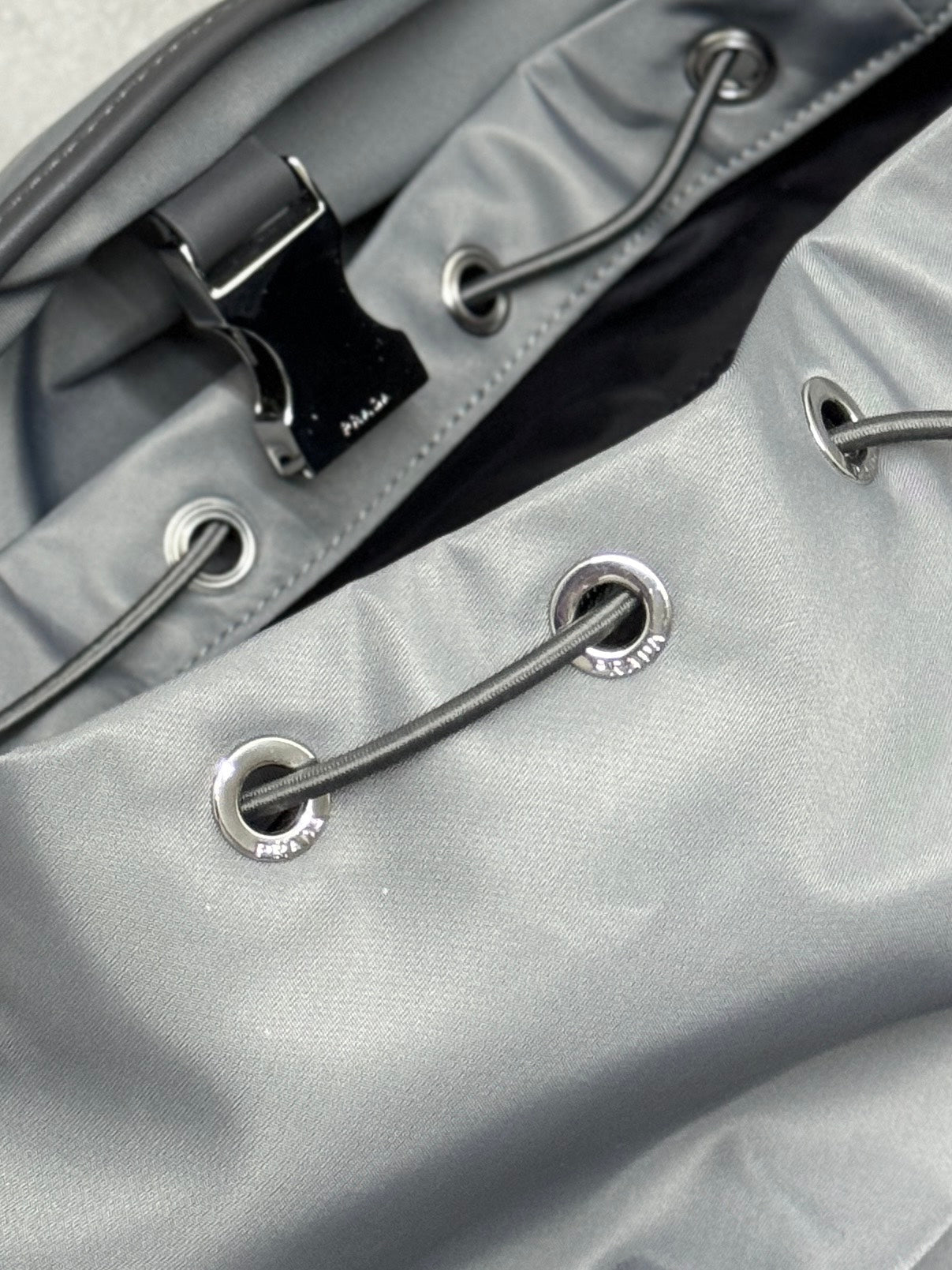 PRADA TRIANGLE LOGO BACKPACK 42 IN RHINO GRAY RE-NYLON