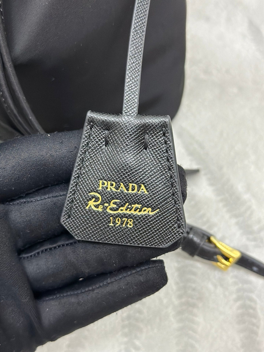 PRADA BUCKET BAG 19 IN BLACK RE-NYLON AND CALFSKIN HANDLE