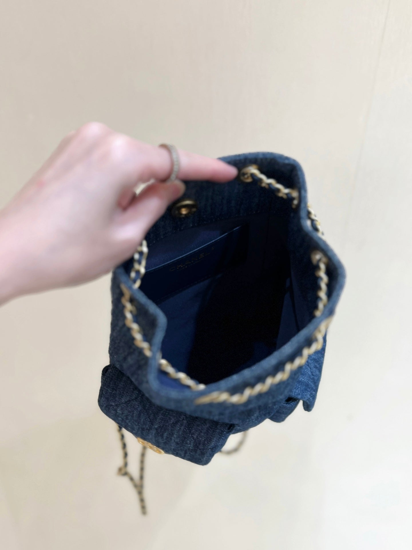 CHANEL DRAWSTRING BUCKET BACKPACK 24 IN DARK BLUE DENIM GOLD HARDWARE